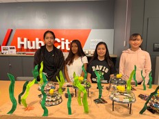 Students pose with the Regenerative Ocean Farm prototype.
