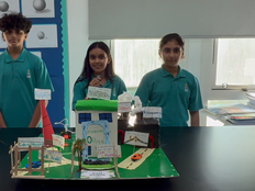 Students present the prototype of the cell city. 